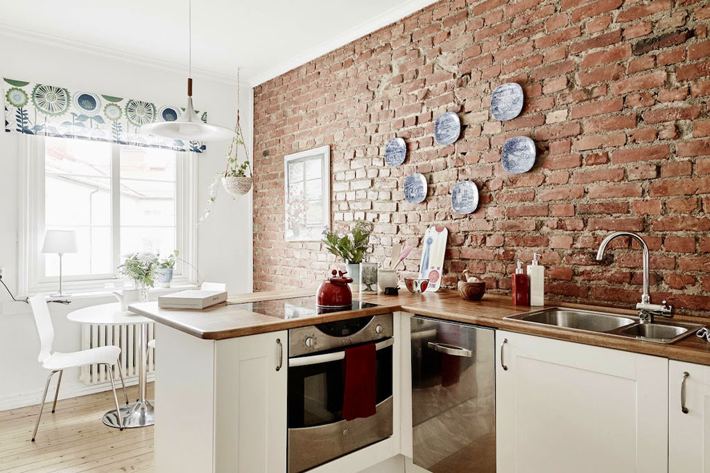cucina-in-metallo-e-pietra-materiali-